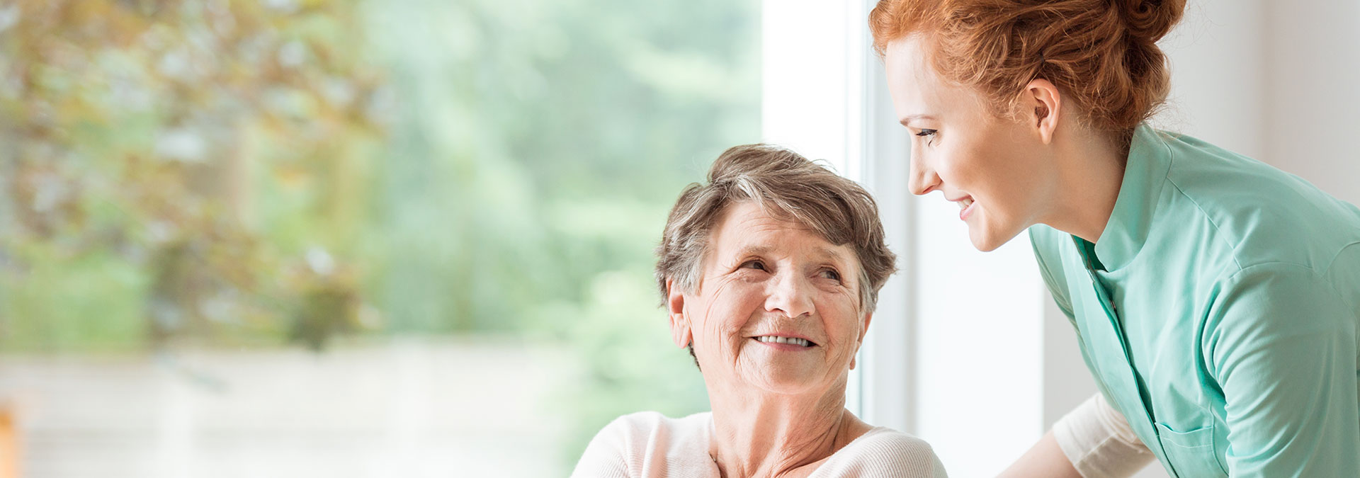 in home caregiver with senior patient